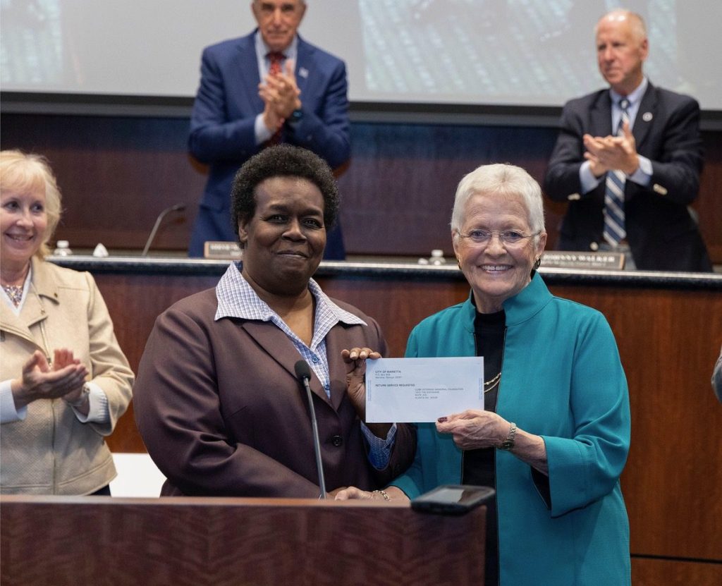 Marietta Councilwoman Cheryl Richardson presents $50,000 donation to CVMF President Donna Rowe